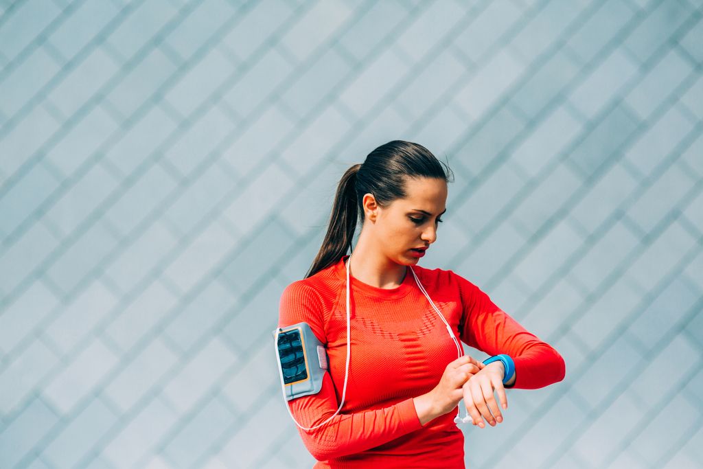 woman checking her fitness tracking watch