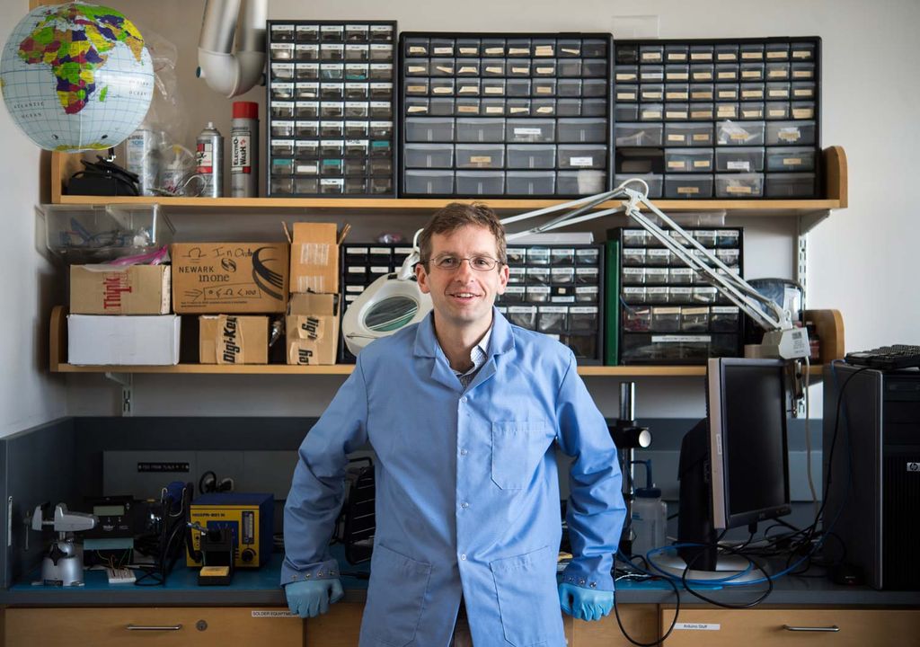 Brian Walsh of the Boston University Center for Space Physics poses for a portrait in his lab