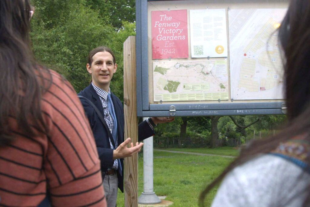 Class instructor Zachary Nowak speaks to students at the Fenway Victory Gardens
