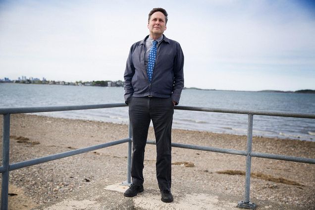 Portrait of R.S. Deese standing on a beach.