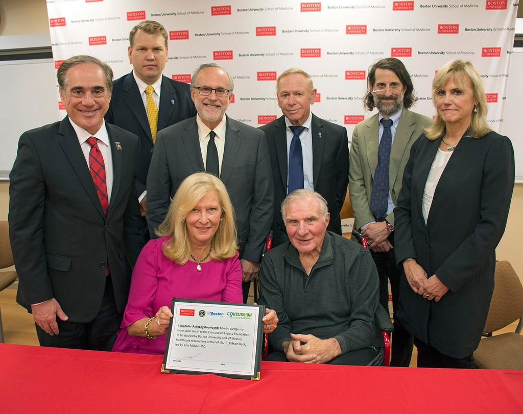 NFL Hall of Famer Nick Buoniconti, his wife, Ann McKee and researchers from the Boston University CTE Center pose for a group photo at a press conference where Nick Buoniconti pledged to donate his brain for CTE research.