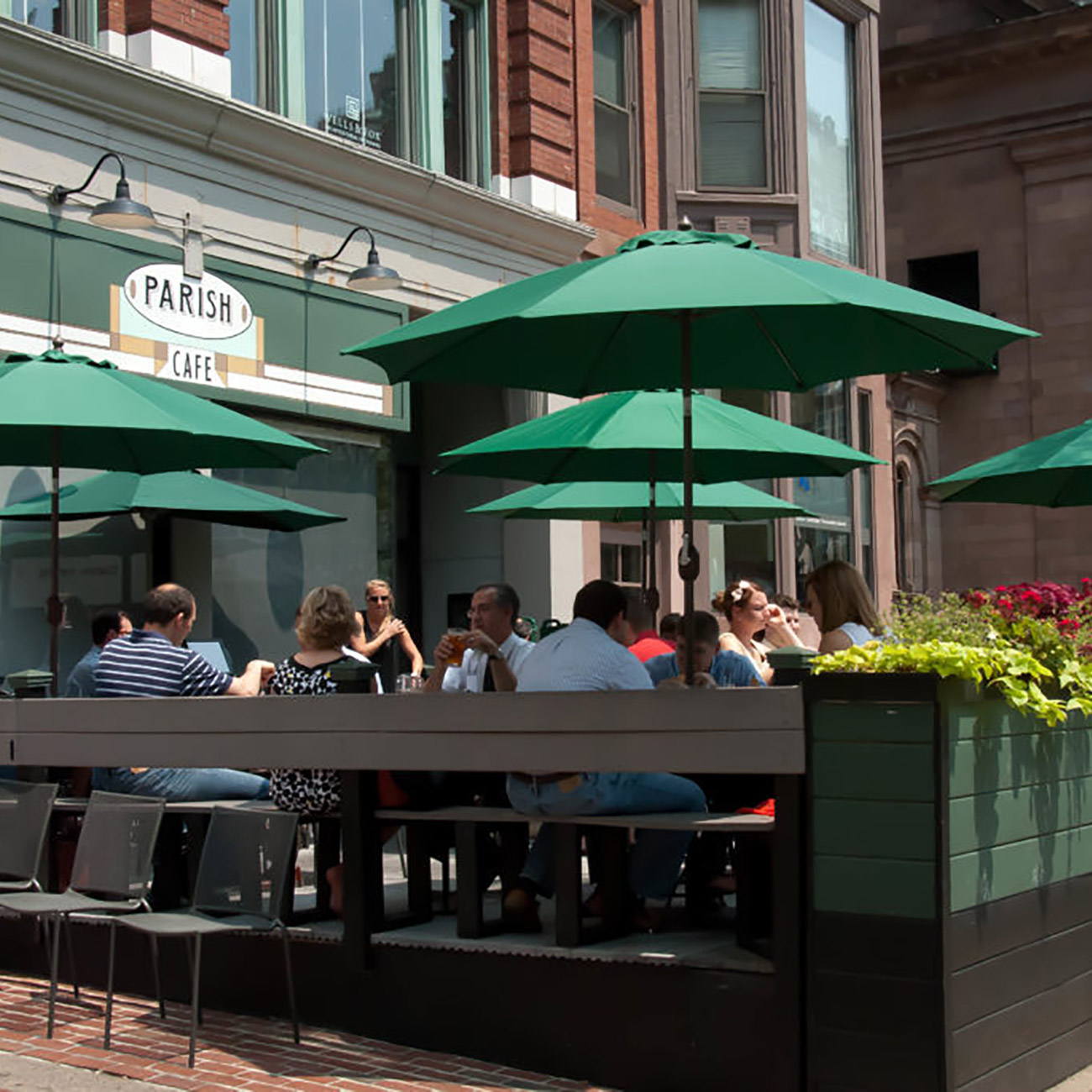 Customers dine on the outdoor patio of Parish Cafe on a sunny day.
