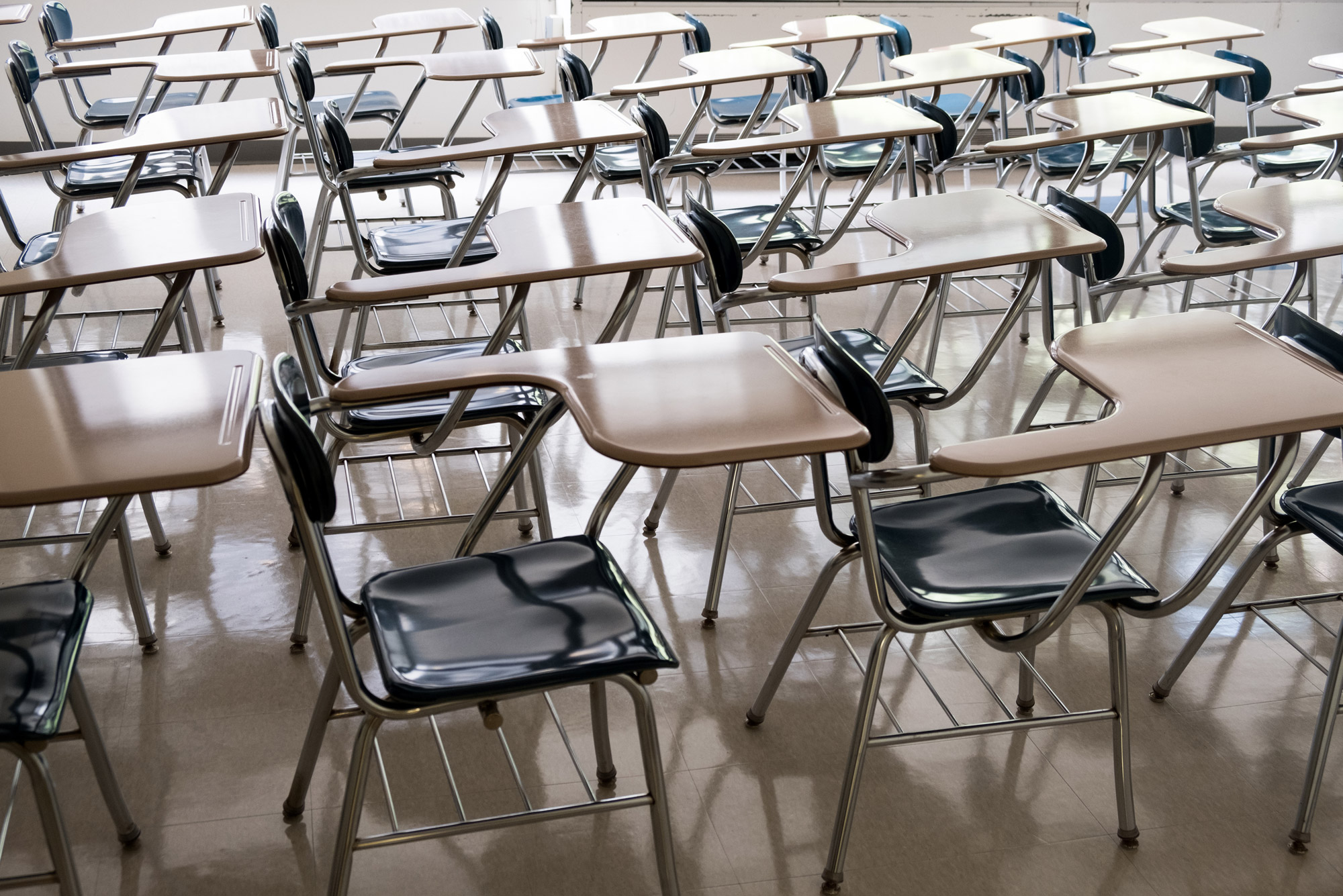 empty classroom desks and chairs