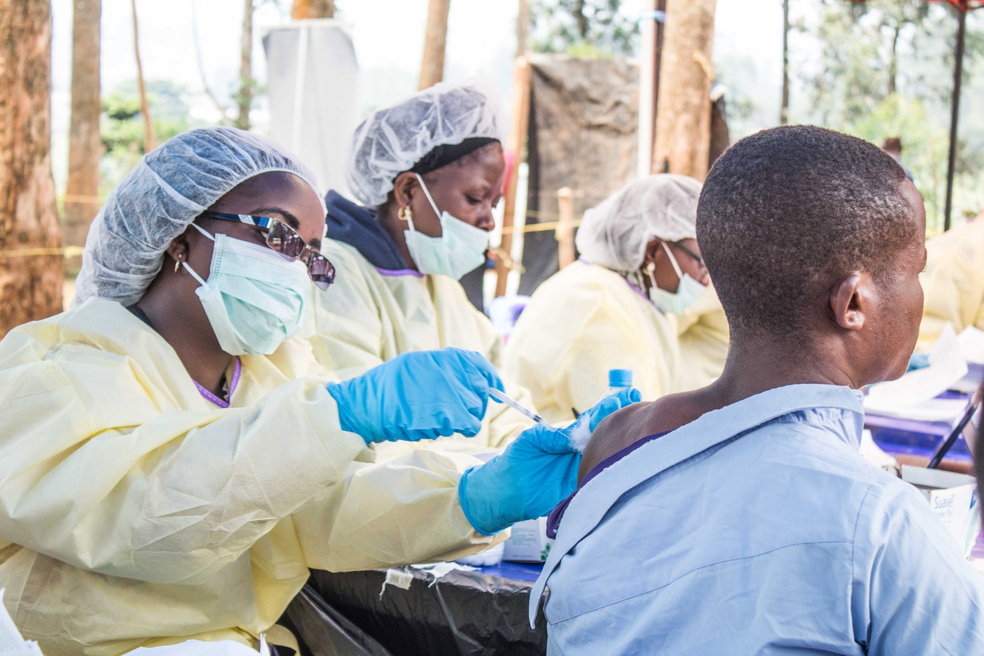 a health worker administers medication to a person in the Congo