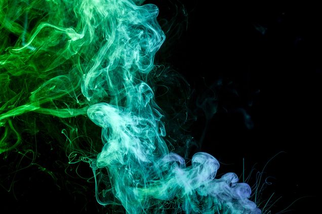 Cloud of smoke against a black background