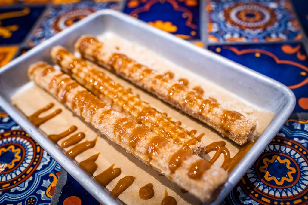 Churros drizzled in dulce de leche