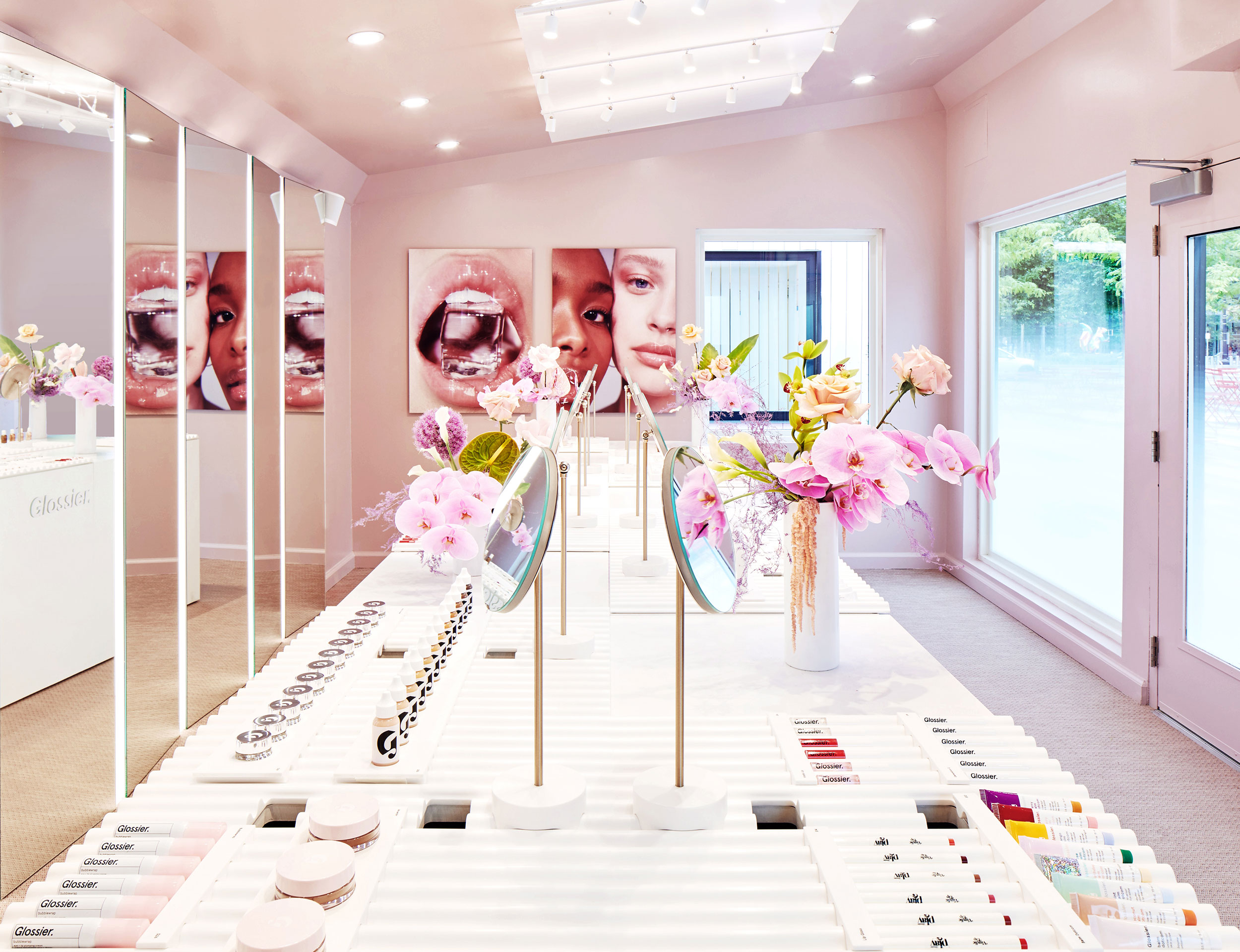 Interior view of the Glossier pop-up store in the Seaport district of Boston.