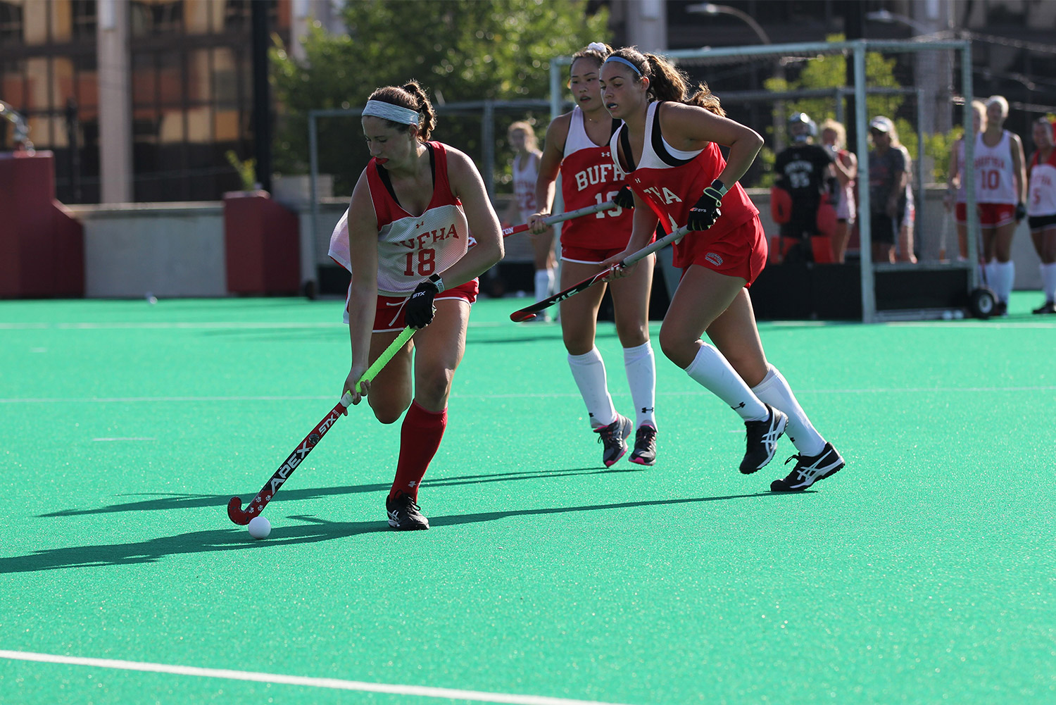 BU Terriers field hockey captain Kiley Gallagher runs with the ball during a game.