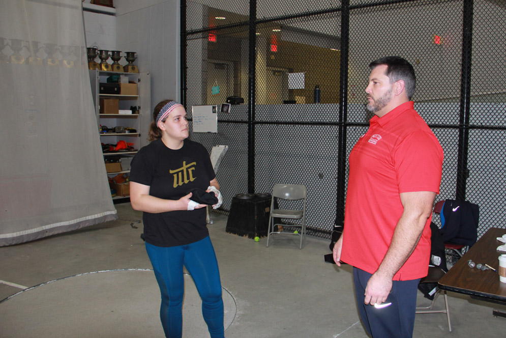 Boston University Terriers track and field athlete Sarah Cicchetti talks to Jarred Rome during a workout.