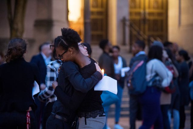 Mourners embrace outside Marsh Chapel following the memorial service for Erin Edwards.