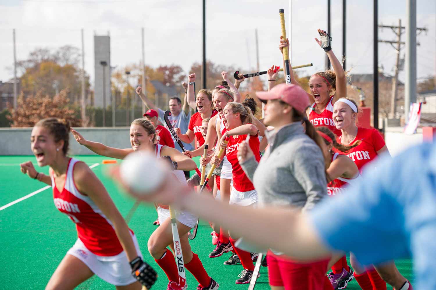 Boston University Terriers varsity field hockey team celebrates a victory on New Balance Field.