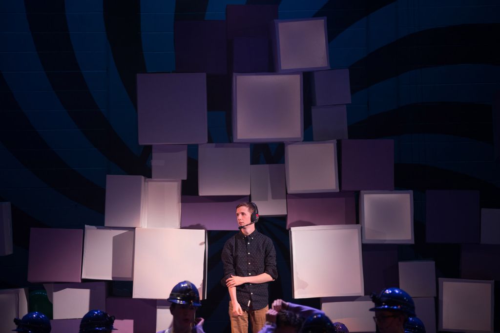 Matthew Robson, the lughtening designer looks around on stage