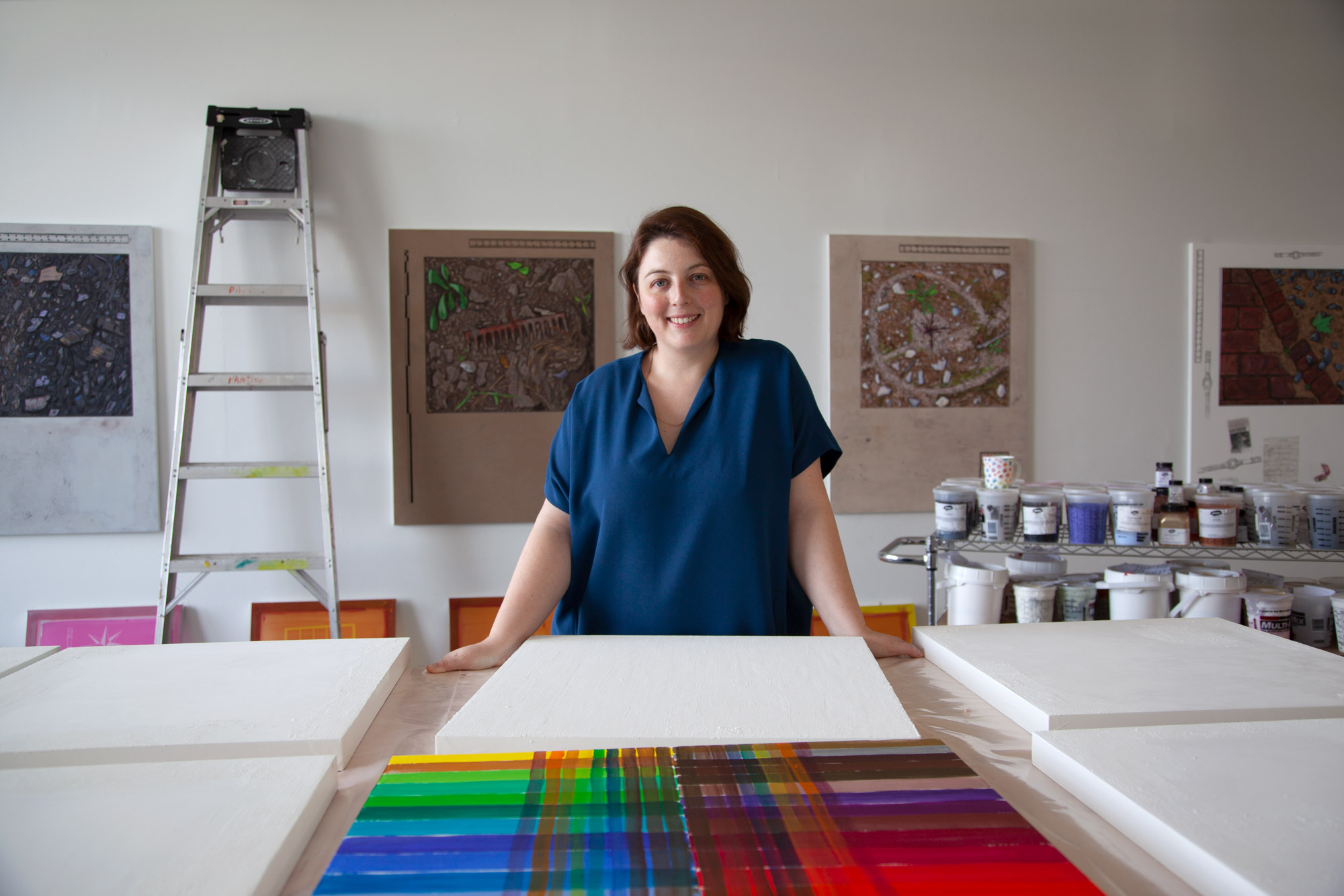 Josephine Halvorson poses in her studio with her artwork