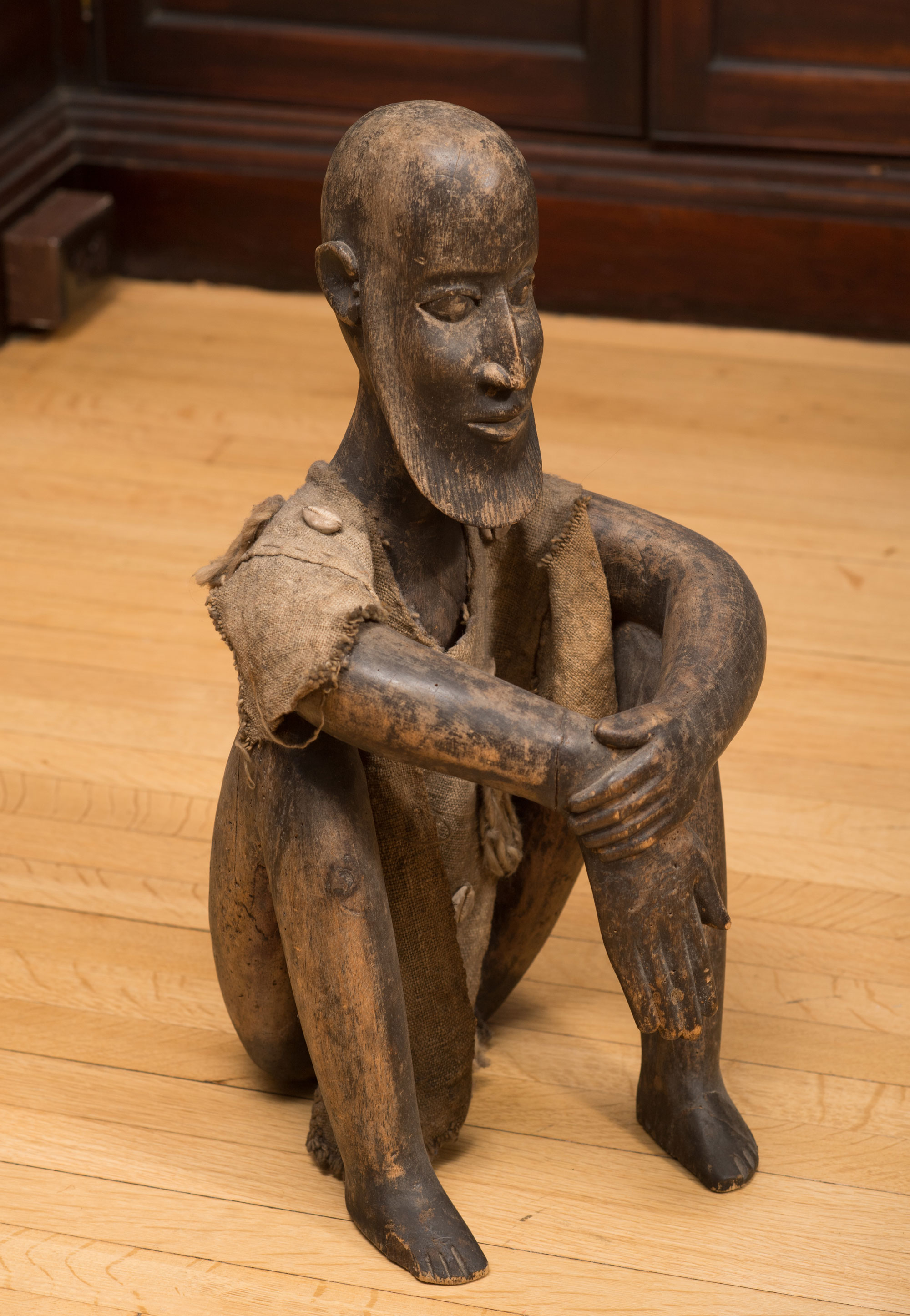 a statue of a figure sitting