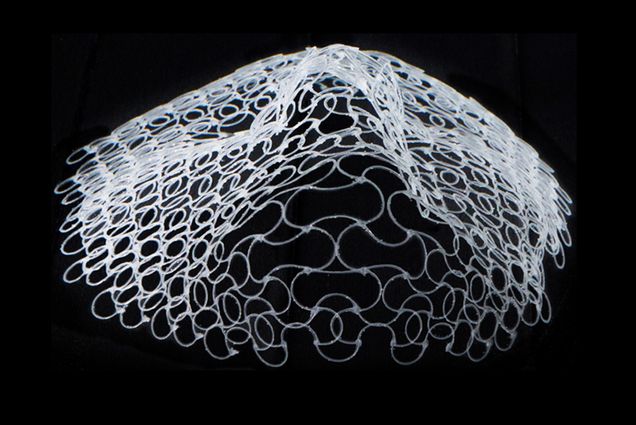 Image of a 4D printed face viewed laying flat looking up from the chin.