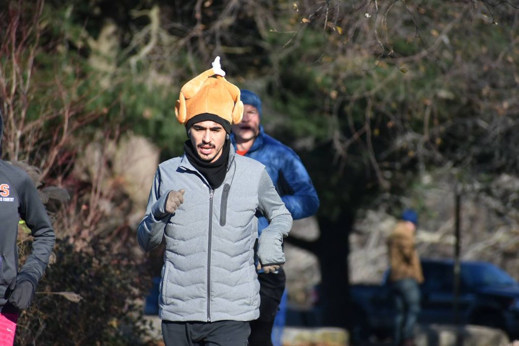 A runner wears a turkey hat during the Franklin Park Turkey Trot