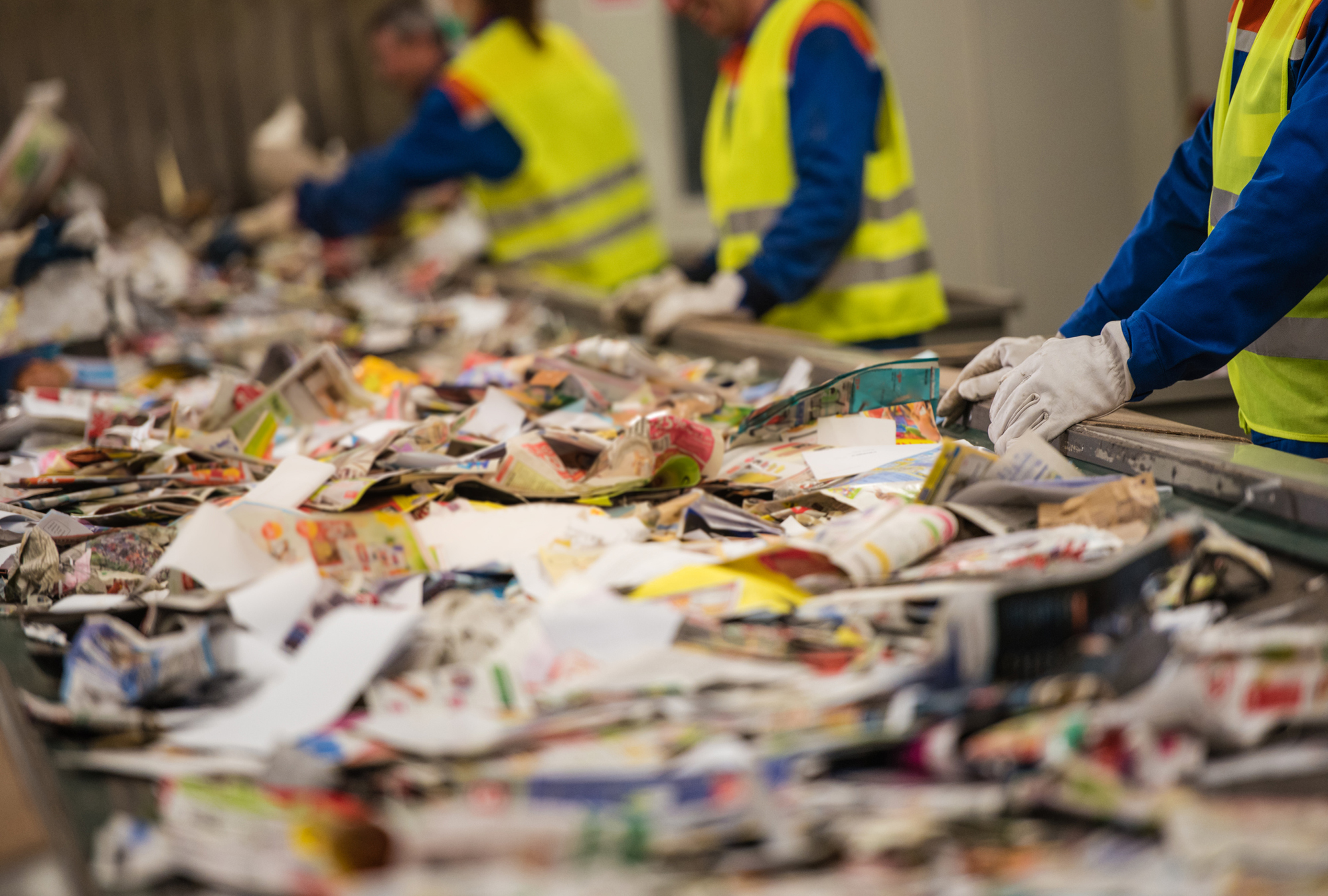 workers assorting recycled goods