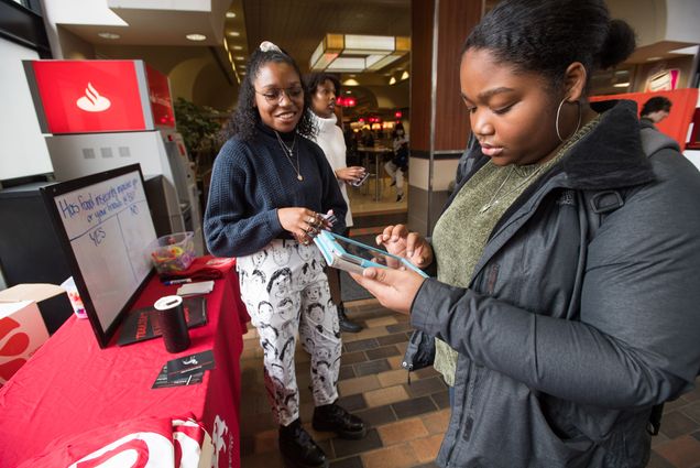 Montiah Norton (CAS’21) signs up on her phone to donate a meal to Terrier Meal Share