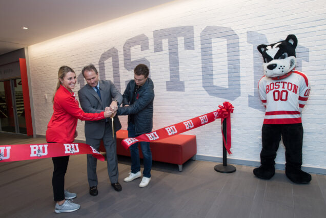 Women's Ice Hockey's Sammy Davis (SAR'19, Wheelock'20), from left, Director of athletics Drew Marrochello, and Men's Tennis' Marc Sable (QST'20) cut the ribbon at the opening of the new Case Center lobby