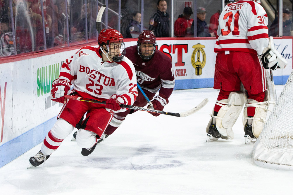 Domenick Fensore skates around the back of the net during a game