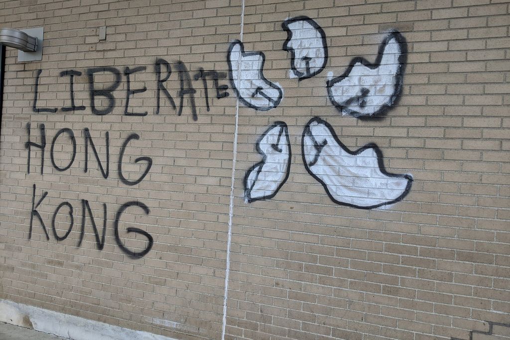 A photo of graffiti reading "Liberate Hong Kong" on the exterior of Warren Towers