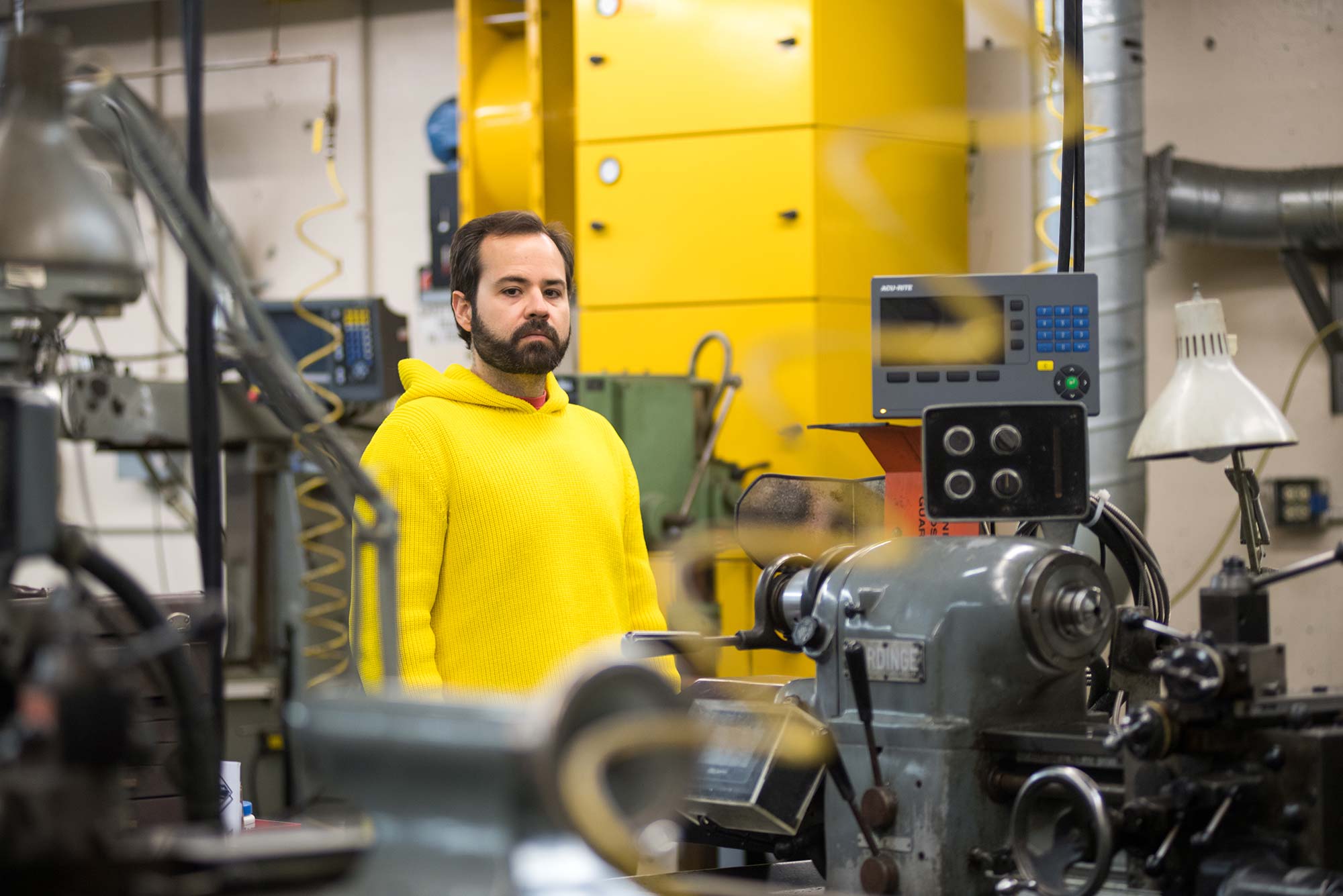 Computational artist Francisco Ruiz Alarcon posese for a portrait in his workshop at Boston University.