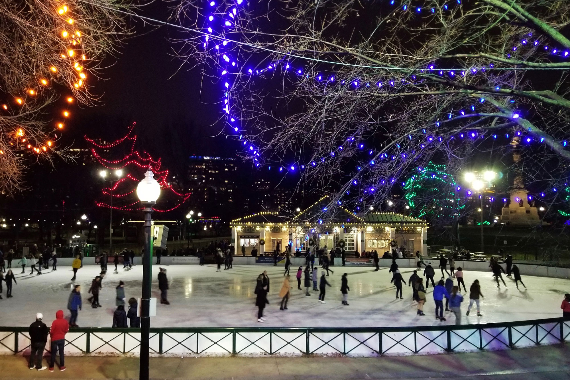 People skate on the Boston Frog Pond at Nighttime