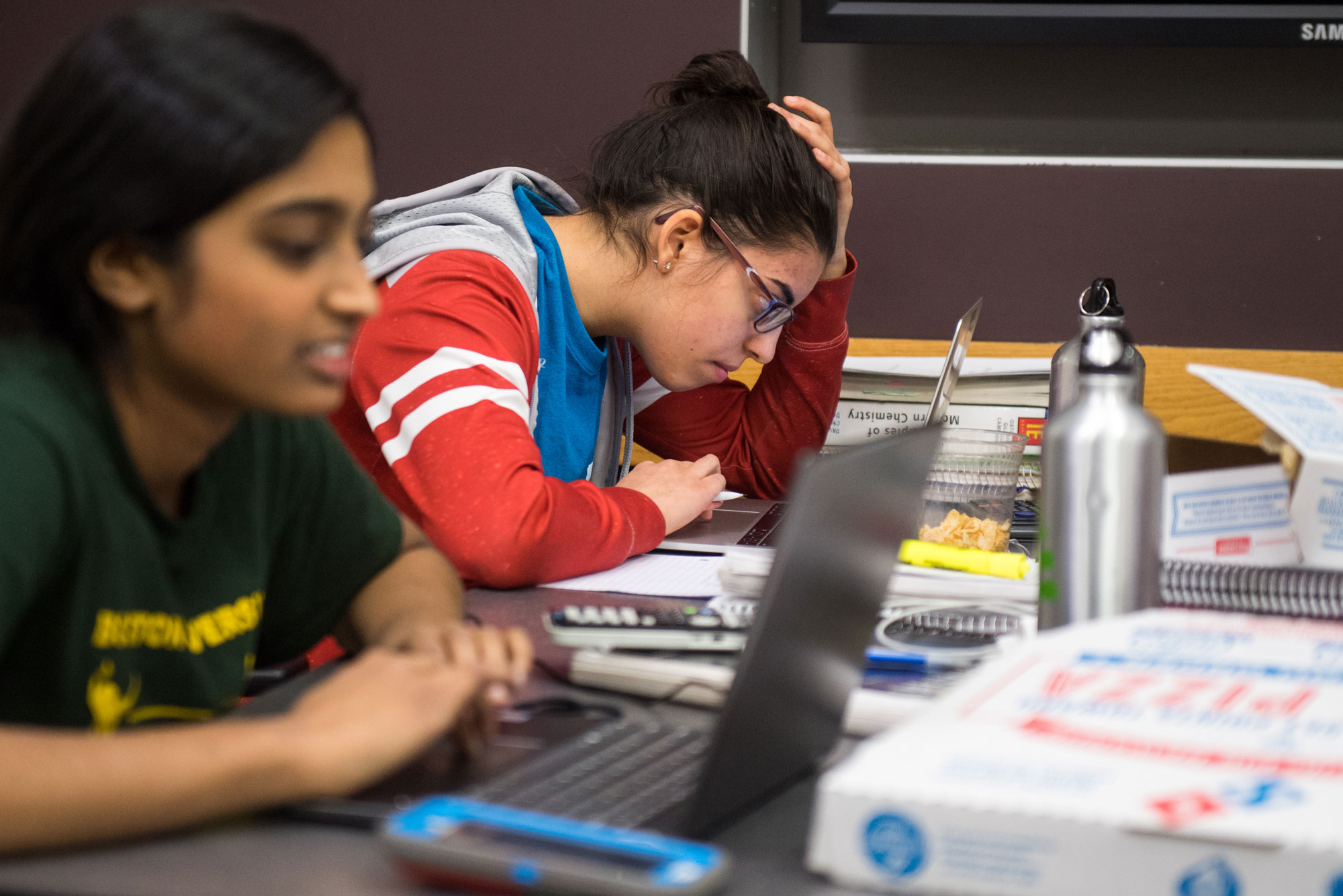 Two students study for a chemistry final in Warren Towers