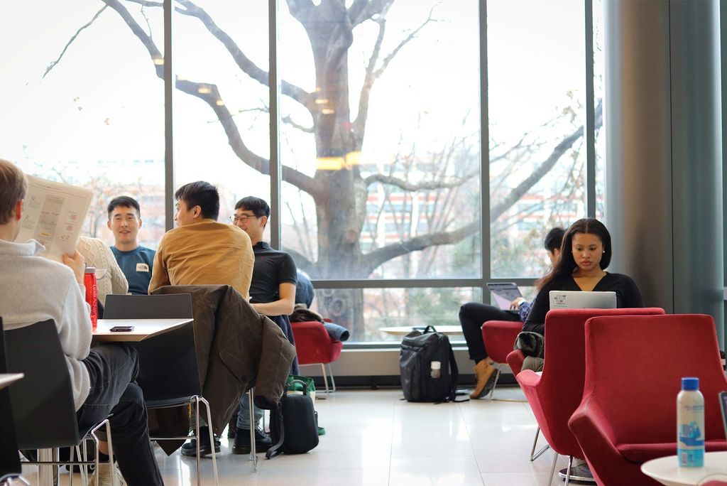 Students read and chat at the Boston University School of Law Cafe.