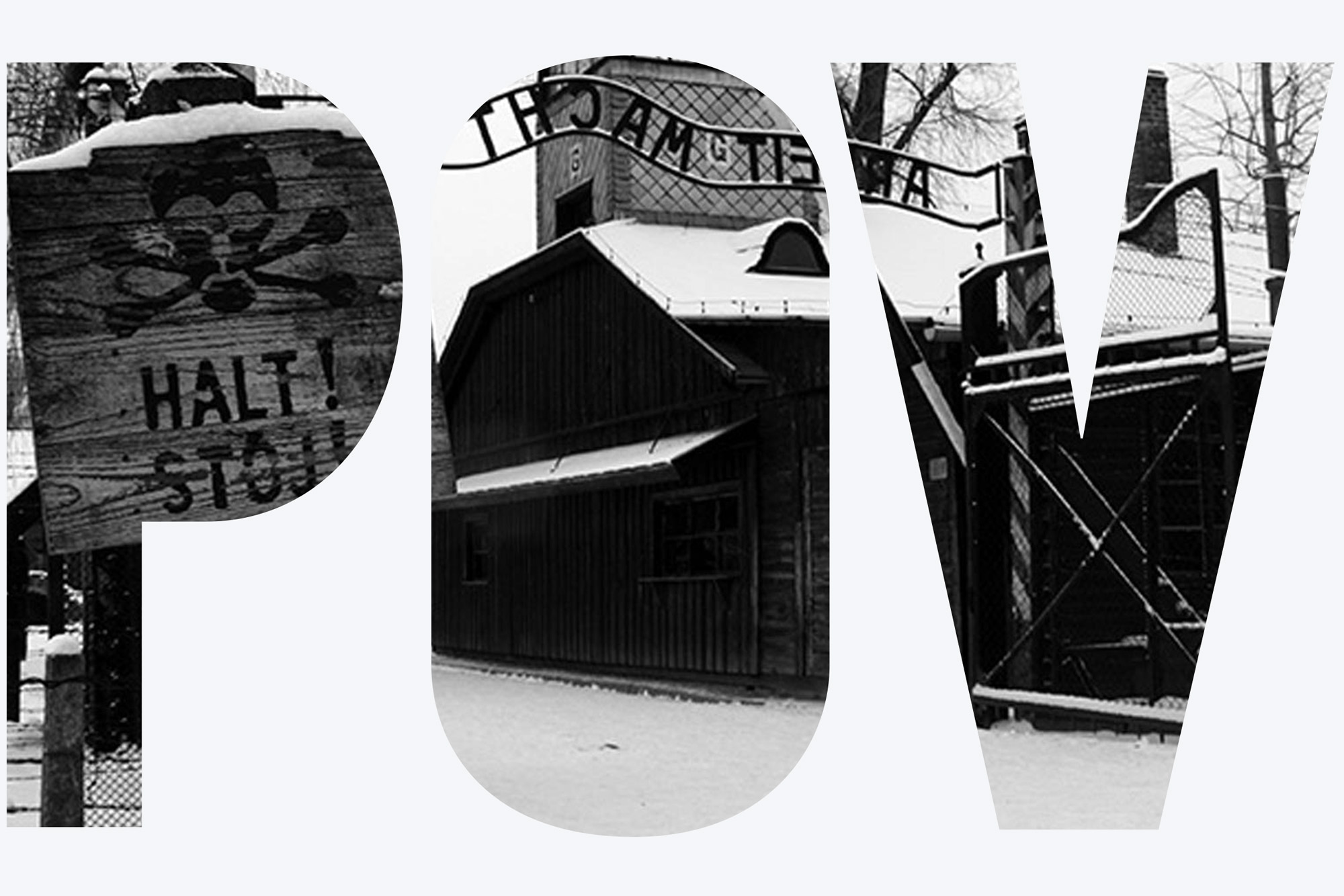 An image of Auschwitz. A sign in the foreground reads "Halt! Stoj!"