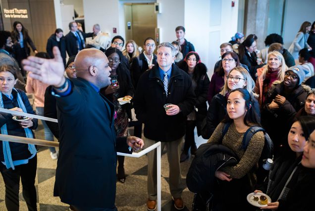 Dean Elmore gives a tour of the new Howard Thurman Center during an opening reception on Tuesday, January 21, 2020