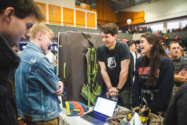 Two students from BU's climbing club talk to another student at Splash 2.0 at the George Sherman Union.