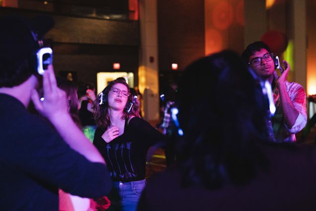 Two students enjoy the the Silent Disco in the GSU Ballroom.