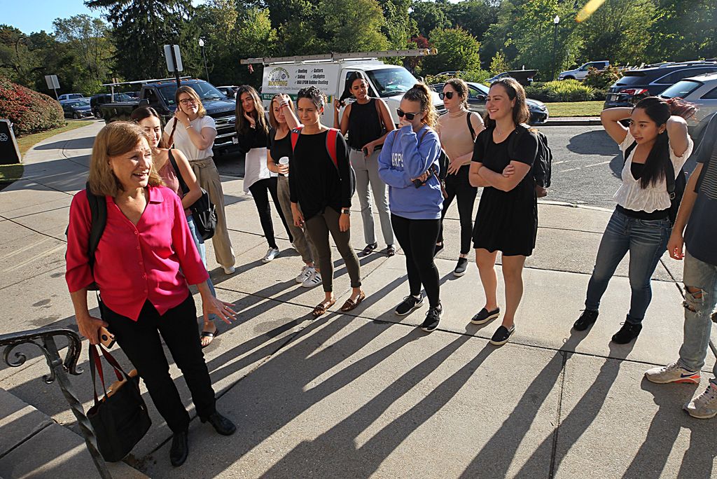 COM adjunct professor Gail Spector leads a group of journalism students on a tour of Newton City Hall.