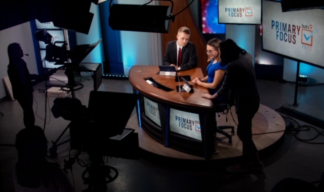 BUTV10 commentators Jacob Wittenberg and Natalie Bennett prepare before the Primary Focus news broadcast.