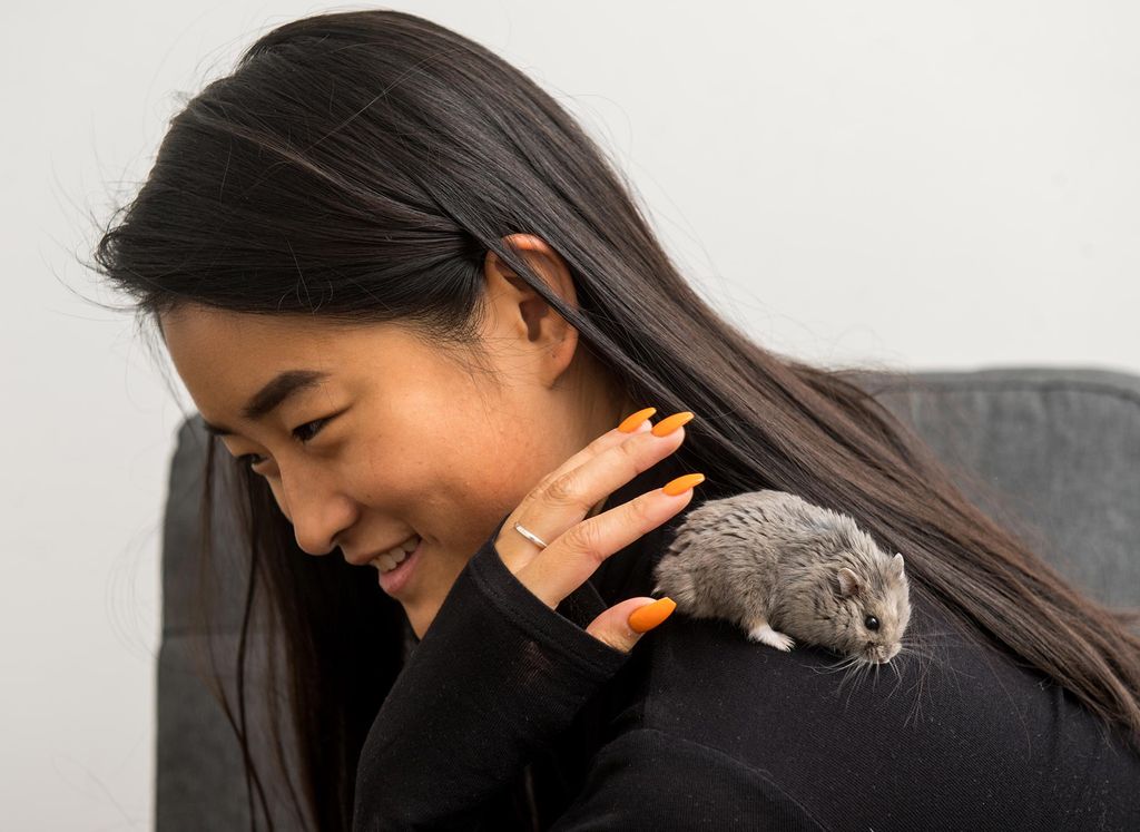 Yujia Zuo with her hamster, Noodle, on her shoulder.