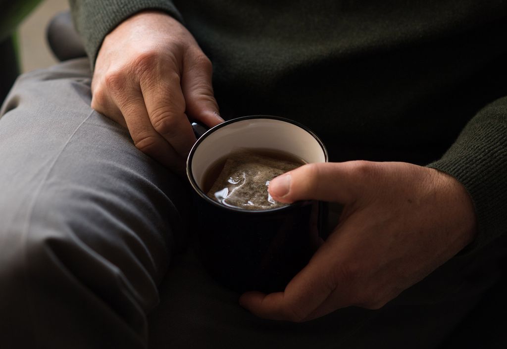 Nathan Phillips holding an unsweetened tea one week into his hunger strike. 