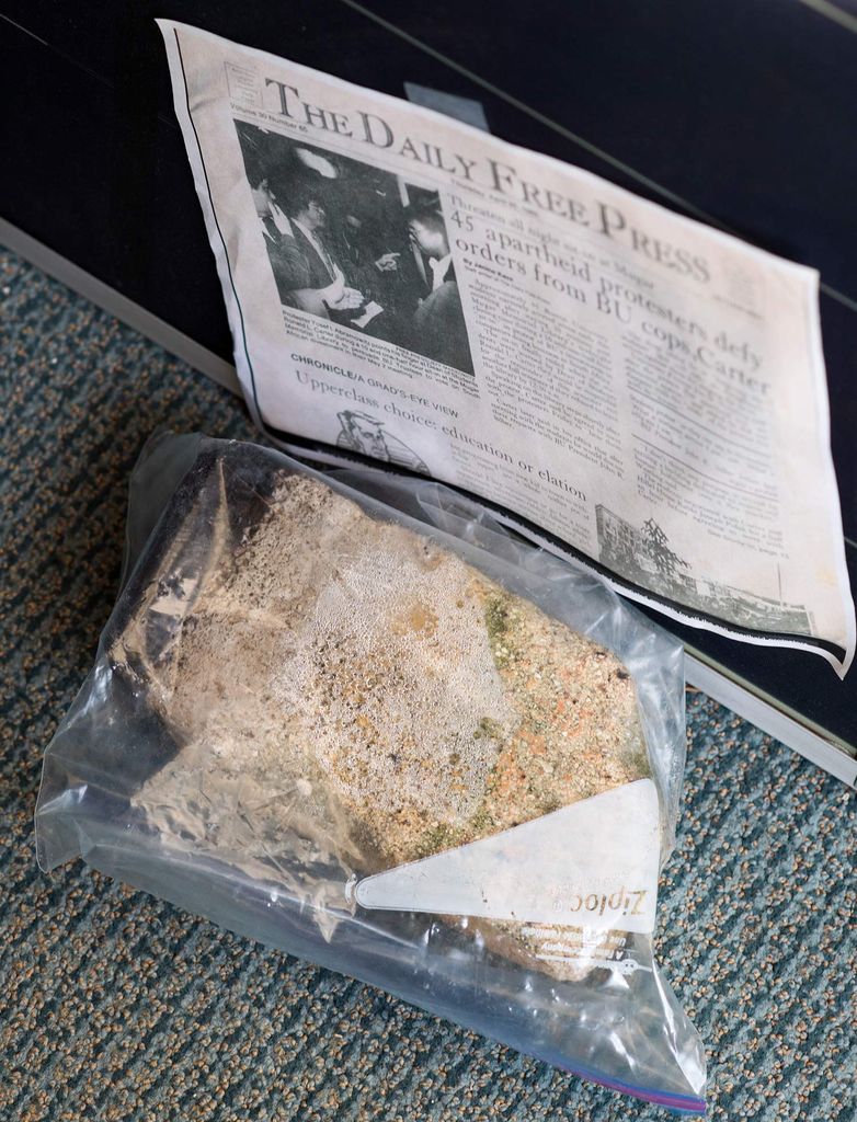 A brick sealed in a plastic freezer bag on the floor of Nathan Phillips' office. He took it from the ground where the natural gas compressor is being built; it very likely contains asbestos.