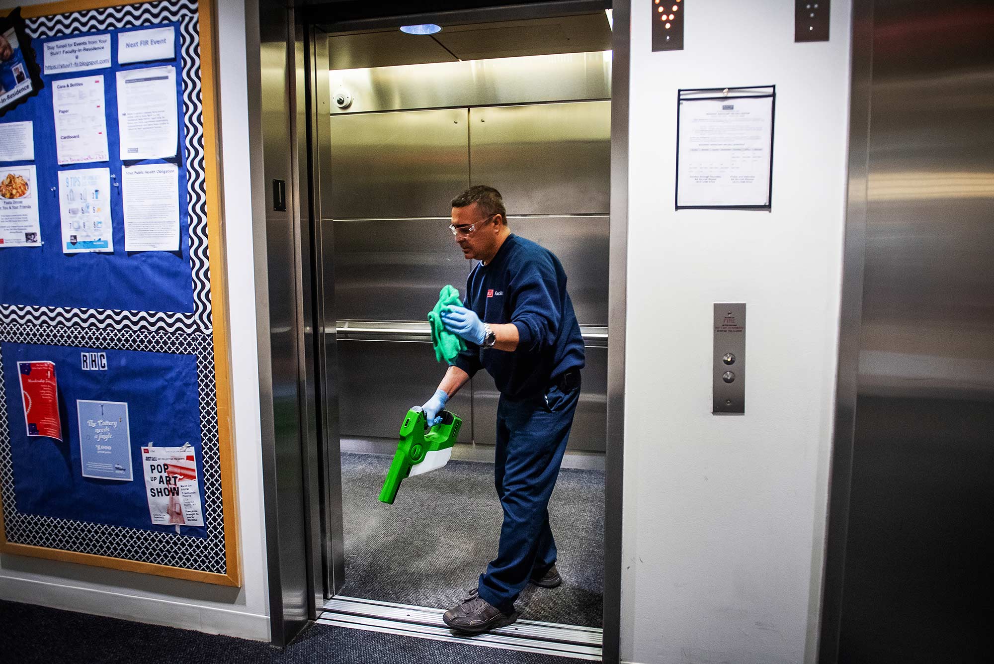 Jon Botelho of BU Facilities cleans StuVi-I elevators with a green gun.
