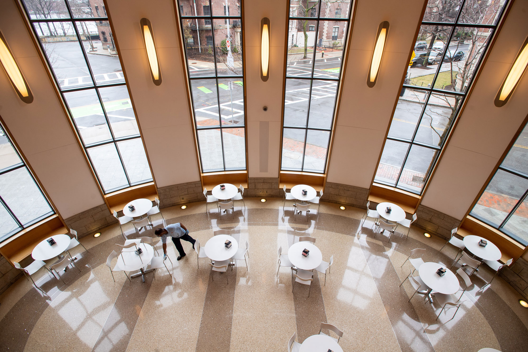 A photo of an employee cleaning Marciano Commons at BU