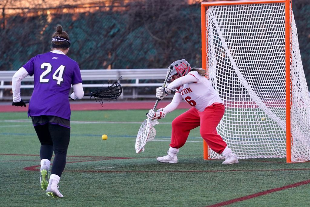 A photo of women's lacrosse goalie Bianca Smith (Questrom '20) making a save