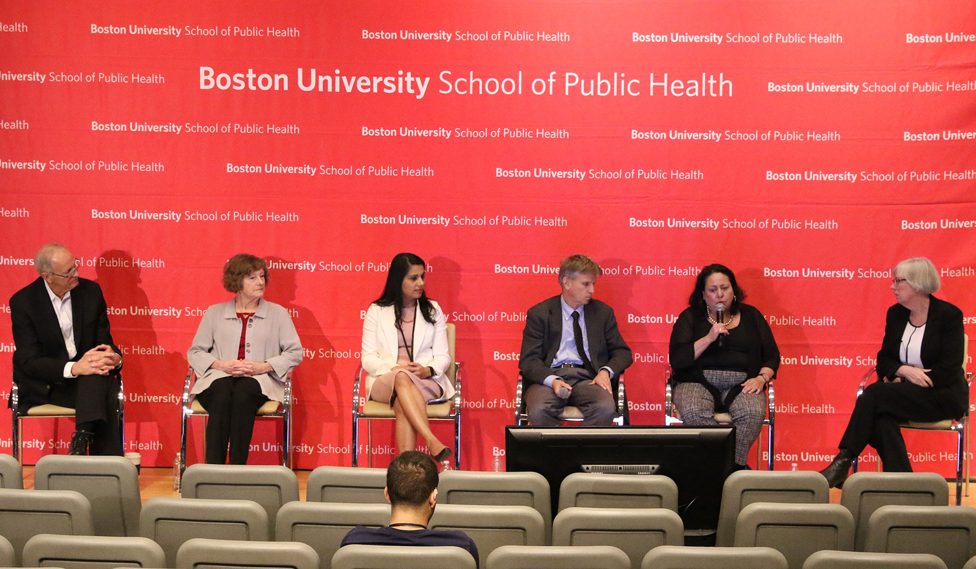 A photo of a panel at a symposium hosted by the School of Public Health on coronavirus