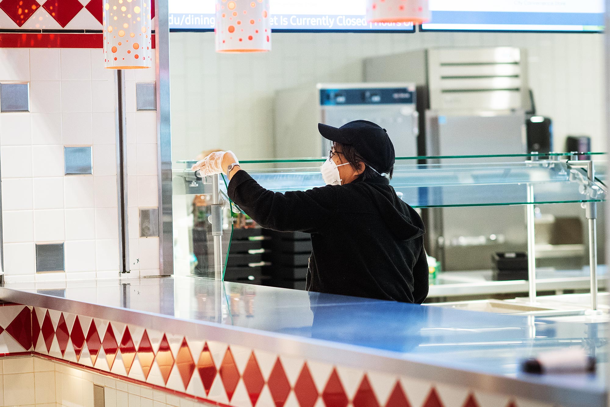 Photo of a worker wiping down counters at the GSU during the campus quarantine on March 16, 2020.