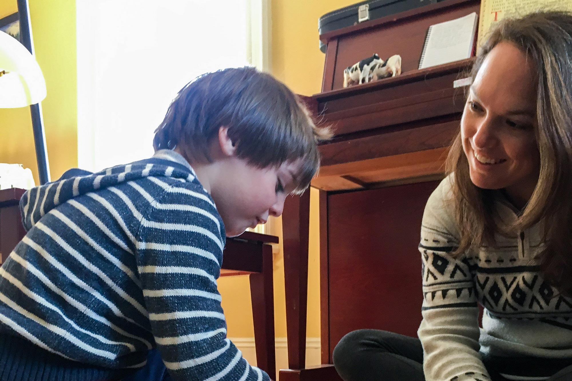 BU early childhood education lecturer Megina Baker plays with her 7-year-old son.