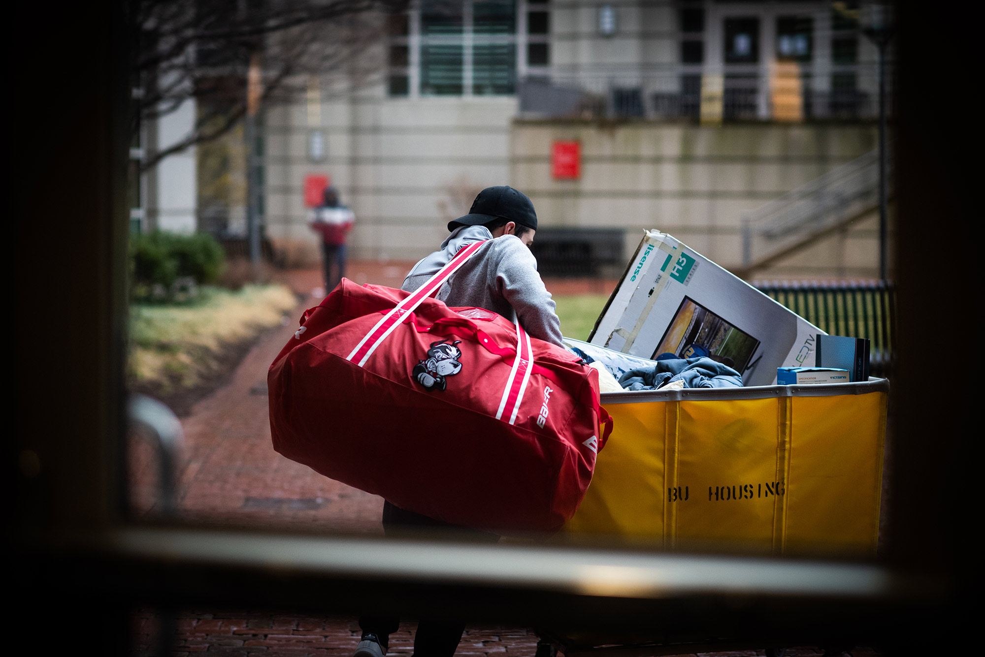 Photo of a student moving out of StuVi-1 on March 17, 2020 as seen through a doorway.