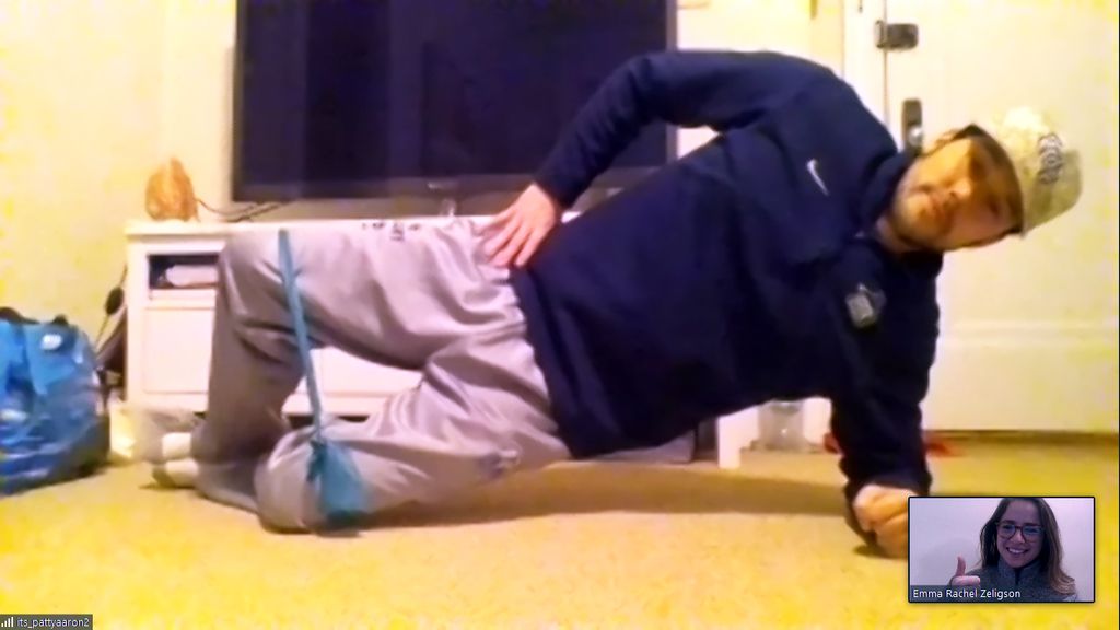 Screenshot of Emma Zeligson (small window) and her friend Patrick demonstrate the efficacy of physical therapy via Zoom.