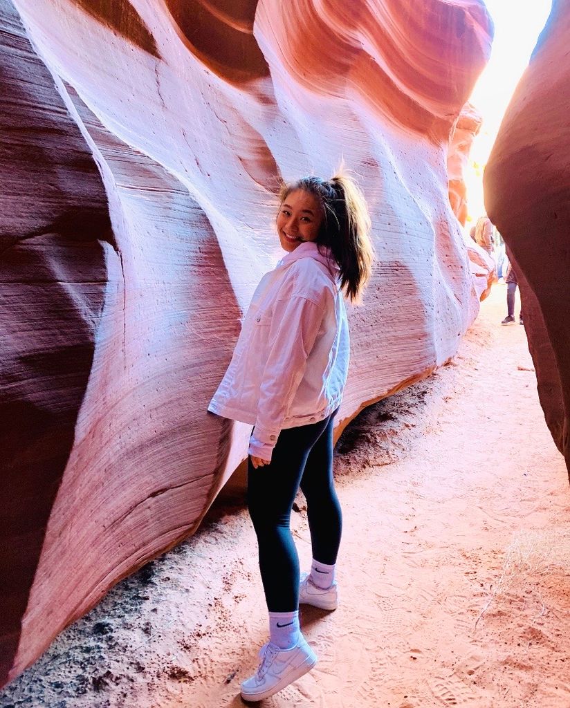 Photo of Clare Kang (Questrom’20) amidst pink-colored boulders.