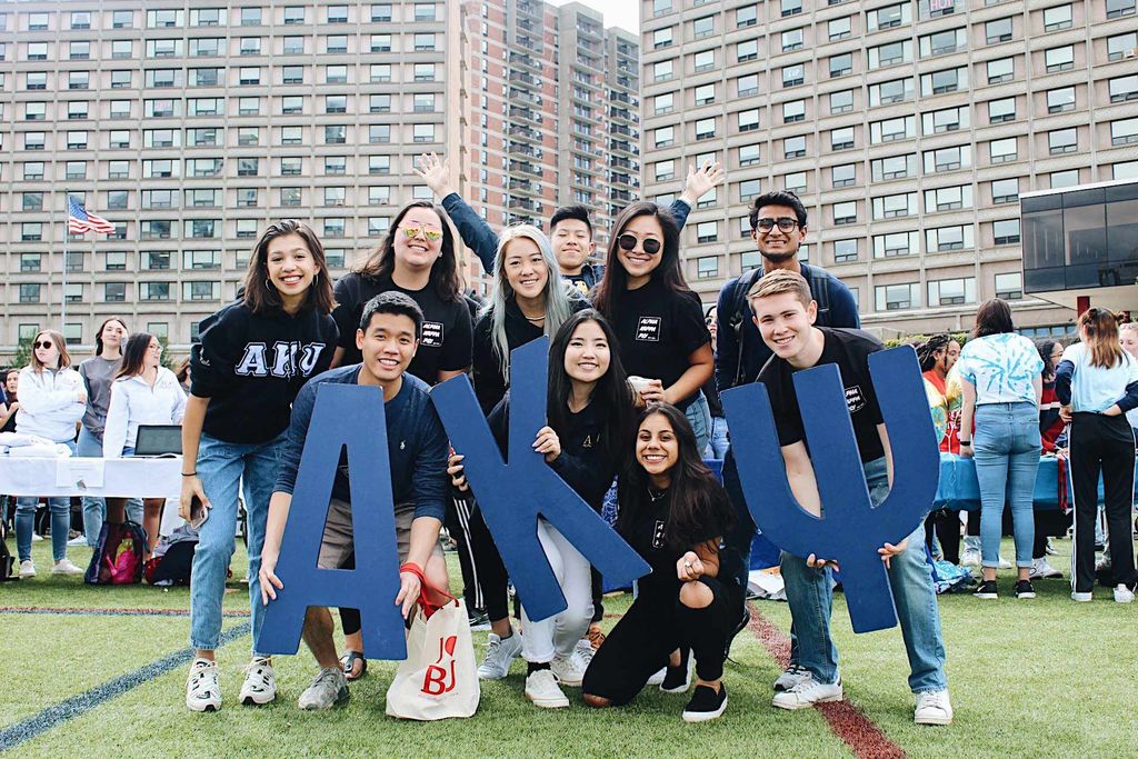 Photo of Emily Zhang (Questrom’20, COM’20) and other members of a group Alpha Kappa Psi.