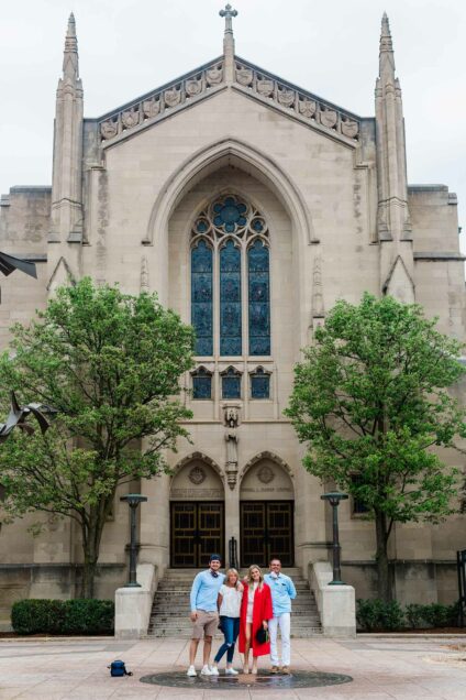 A BU graduate and her family pose at Marsh chapel May 17, 2020. 