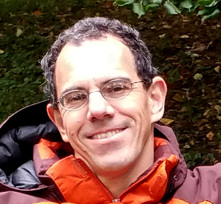 Photo of Jason Prentice in an orange winter coat.